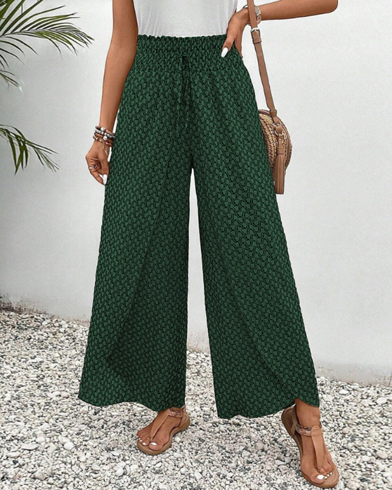 Pantaloni donna gamba larga, stampa geometrica audace, perfetti per un look moderno e distintivo.