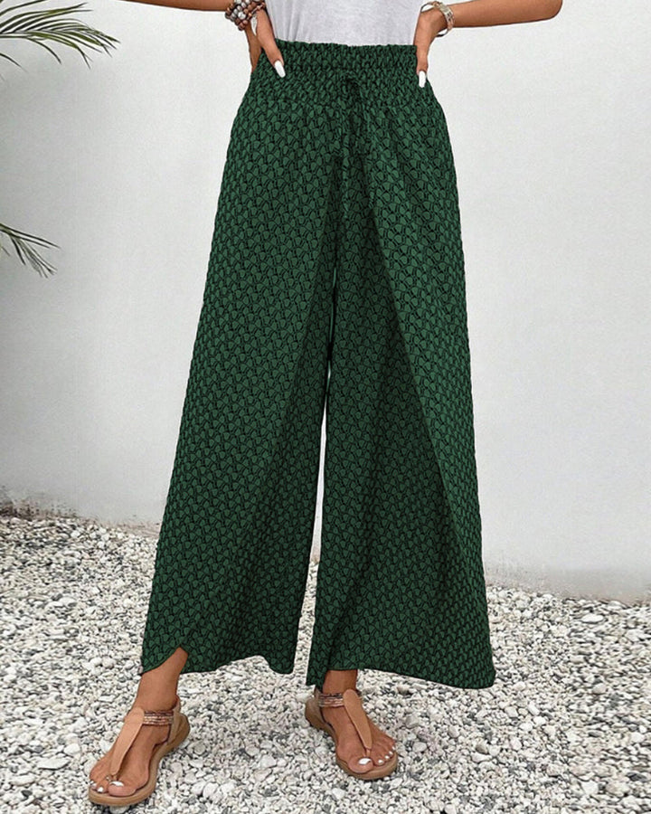 Pantaloni larghi donna con stampa geometrica, vita alta per un look sofisticato e alla moda.