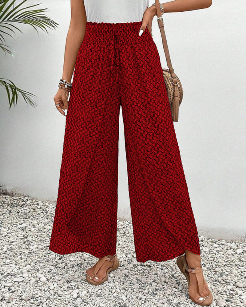 Comodi pantaloni larghi primaverili da donna, fantasia geometrica, stile versatile e moderno.