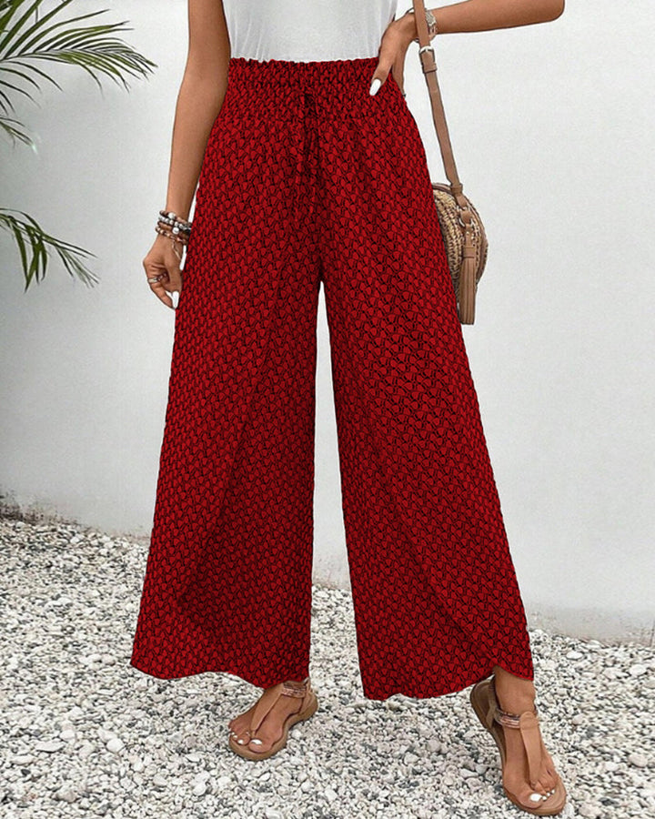 Comodi pantaloni larghi primaverili da donna, fantasia geometrica, stile versatile e moderno.