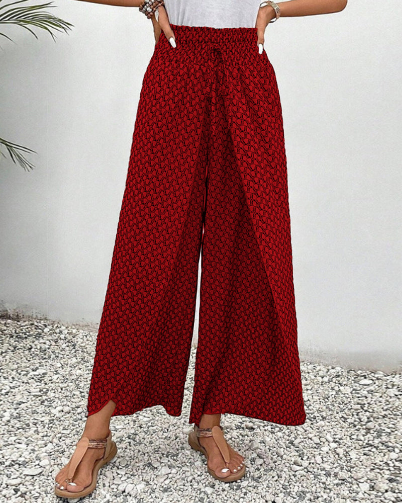 Versatili pantaloni donna gamba larga, stampa geometrica vivace, perfetti per il giorno e la sera.