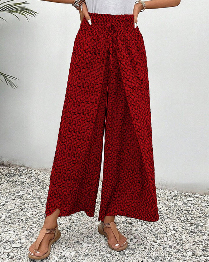 Versatili pantaloni donna gamba larga, stampa geometrica vivace, perfetti per il giorno e la sera.