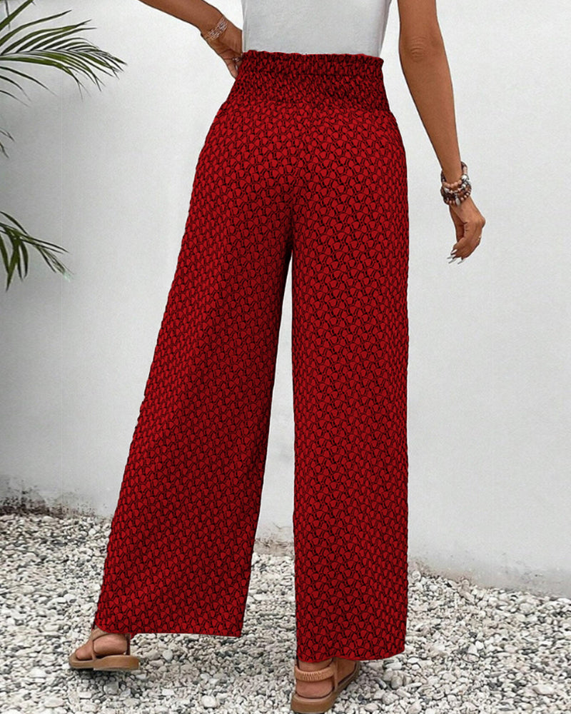 Pantaloni moda donna con stampa geometrica accattivante, vita alta e gamba larga per comfort chic.