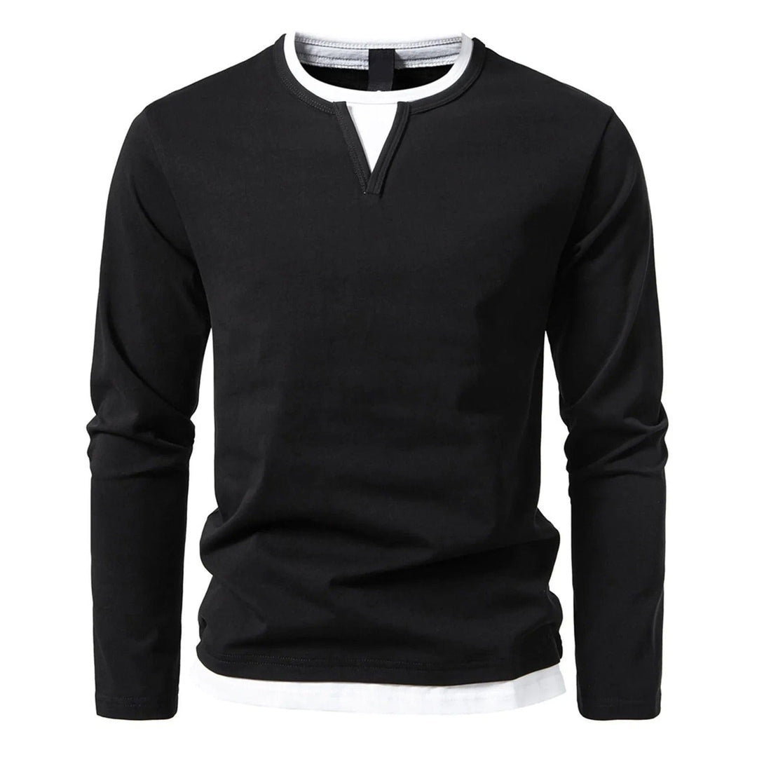 Top uomo nero a maniche lunghe, polo versatile con effetto a strati, ideale per abbigliamento casual chic.