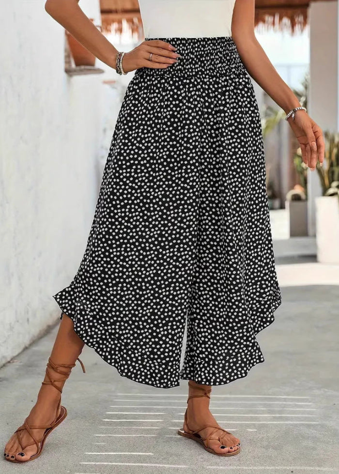 Comodi pantaloni a gamba larga da donna, a pois e vita alta, freschi per la primavera e l'estate. Abbigliamento femminile.