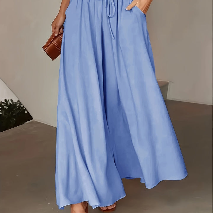Pantaloni palazzo donna in tessuto leggero, vita alta, ideali per la calda stagione estiva.