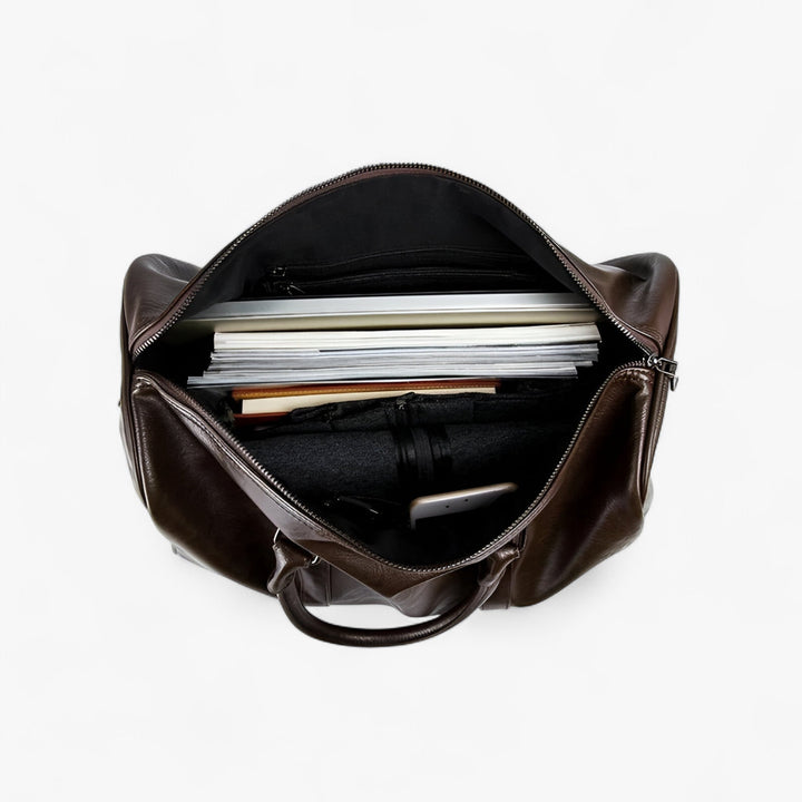 Accessorio uomo: borsone nero da viaggio e palestra con tracolla removibile, ideale per sport e weekend.
