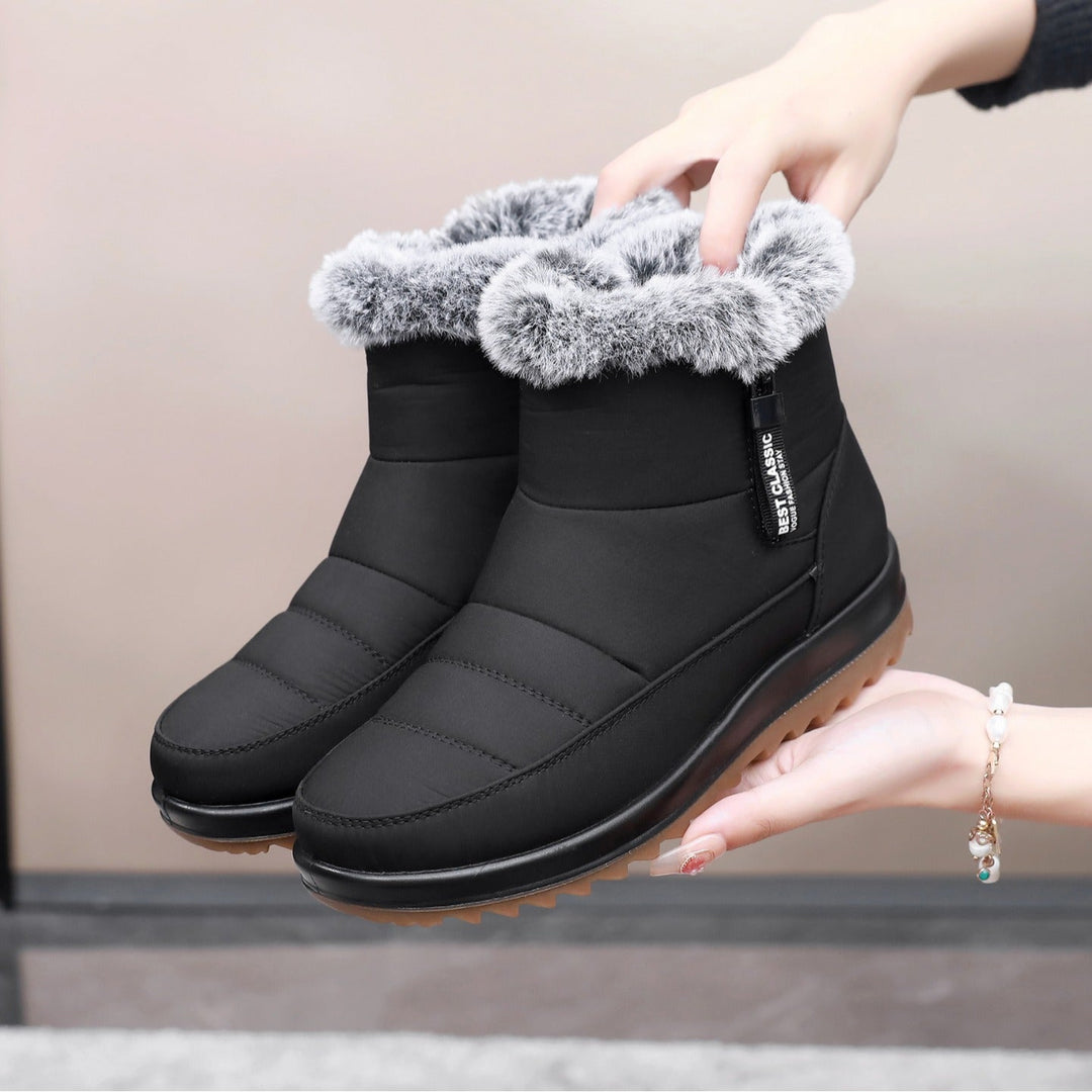Stivaletti donna invernali con comoda zip. Caldi e protettivi per la neve, offrono comfort e stile in ogni situazione.