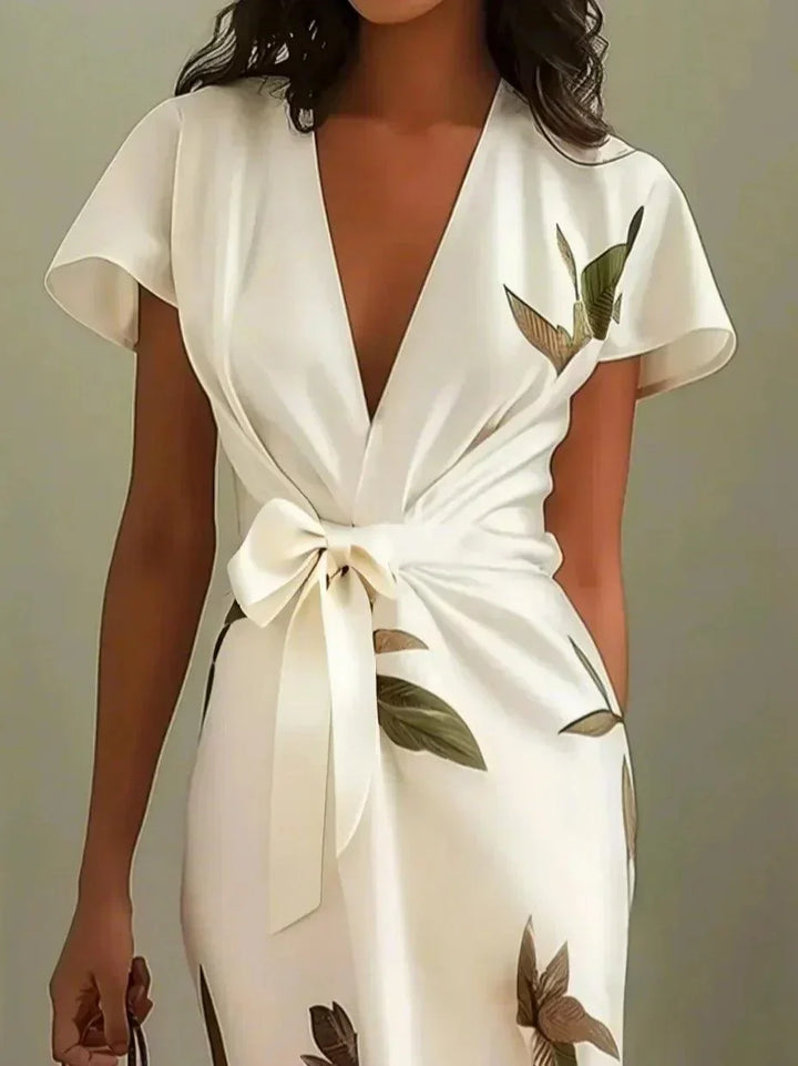 Abito midi floreale per donna, con maniche corte a volant e design incrociato, per un look fresco e stiloso.