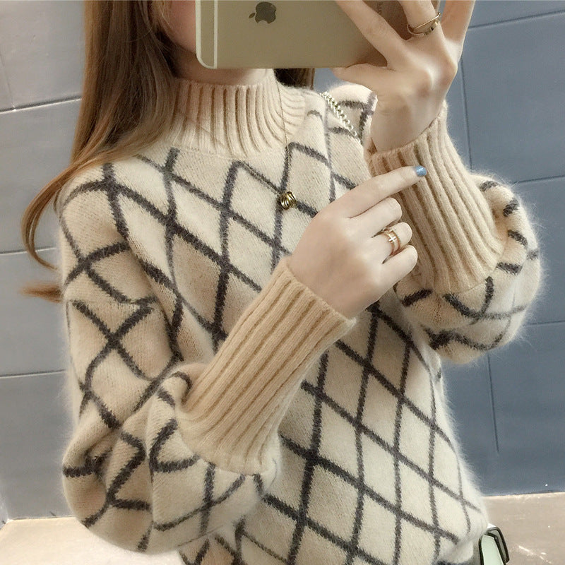 Elegante maglione da donna con fantasia a rombi e scollo rotondo, must-have per l'inverno.