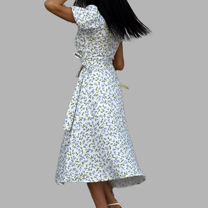 Moda primavera/estate: abito midi donna floreale con scollo a V, maniche a palloncino, nuova collezione elegante.