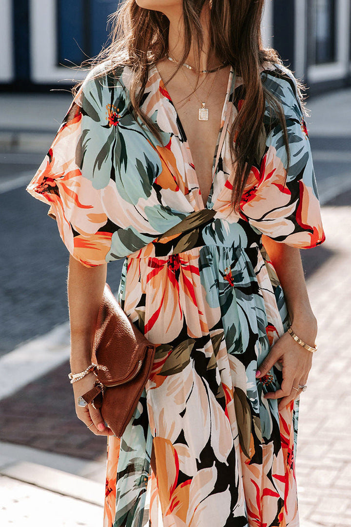 Abito lungo elegante donna, profondo scollo a V e spacco laterale, perfetto per la moda estiva femminile.