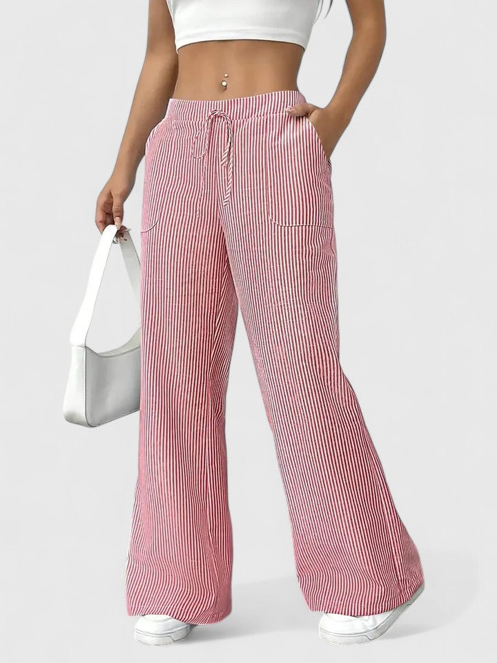 Pantaloni donna estivi ampi e fluidi, vita alta con laccio. Perfetti per outfit eleganti o casual.