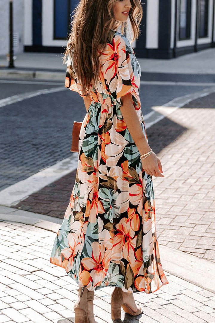 Maxi abito donna chic, scollo a V e spacco laterale. Abbigliamento femminile elegante e comodo per l'estate.
