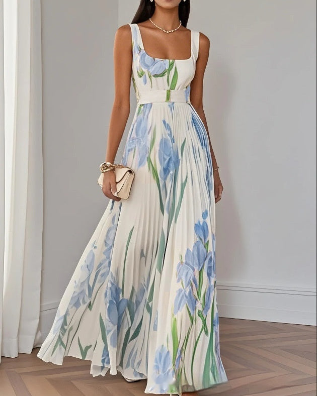 Vestito lungo plissettato da donna con vita alta e stampa floreale, spalline sottili per un look estivo femminile.
