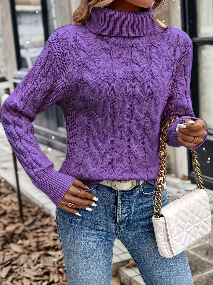 Maglia donna invernale a trecce, collo alto. Un capo versatile e confortevole.