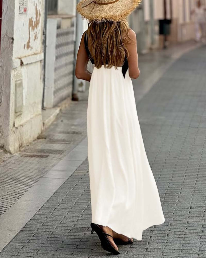 Abito elegante incrociato da donna, vestito lungo fluido per matrimoni e occasioni speciali.