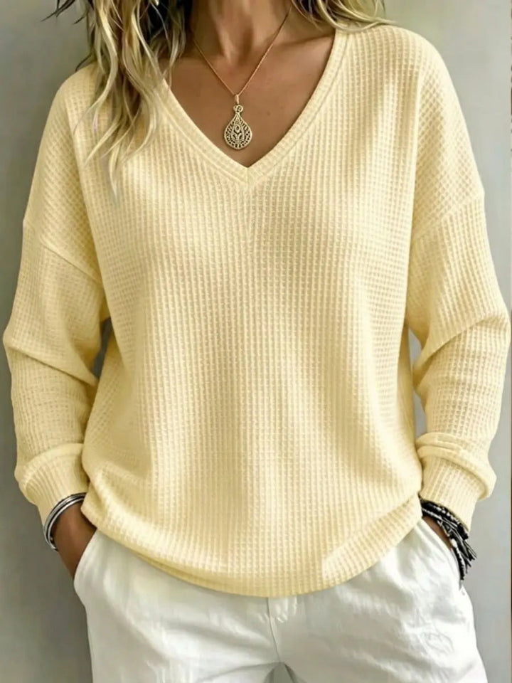 Maglione donna con scollo a V, ideale per abbigliamento quotidiano e comfort totale.