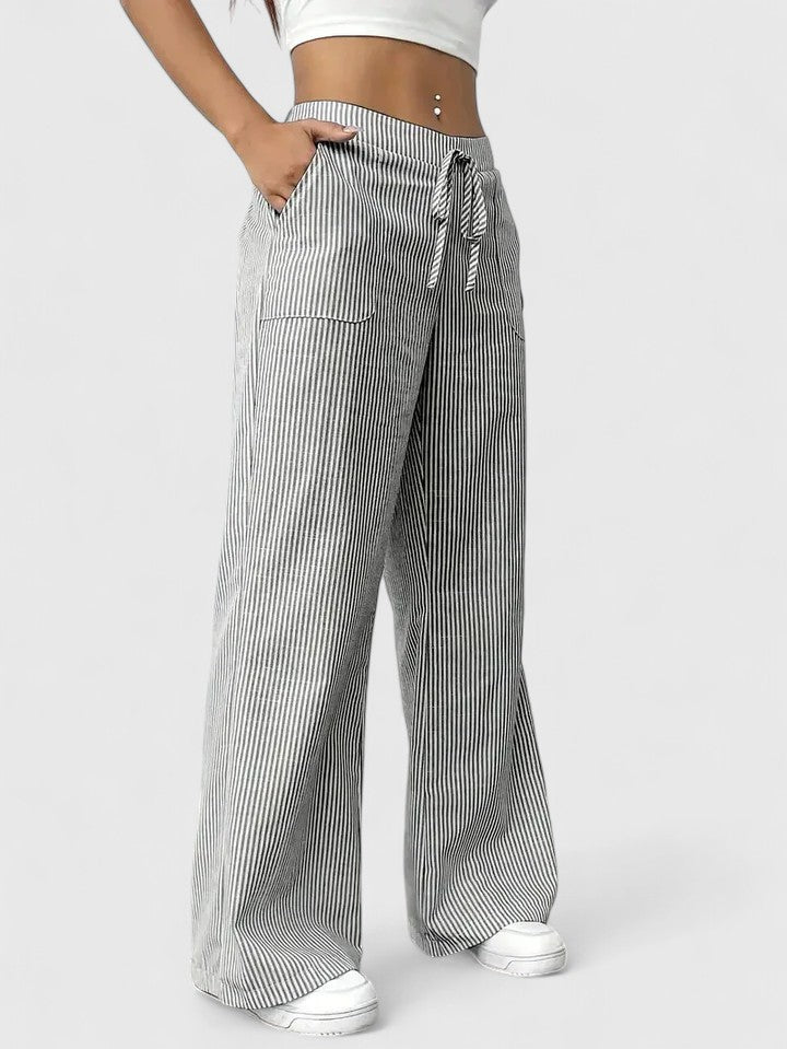 Pantaloni donna estivi ampi, vita alta con laccio in vita e tasche. Per comfort e look fluido.