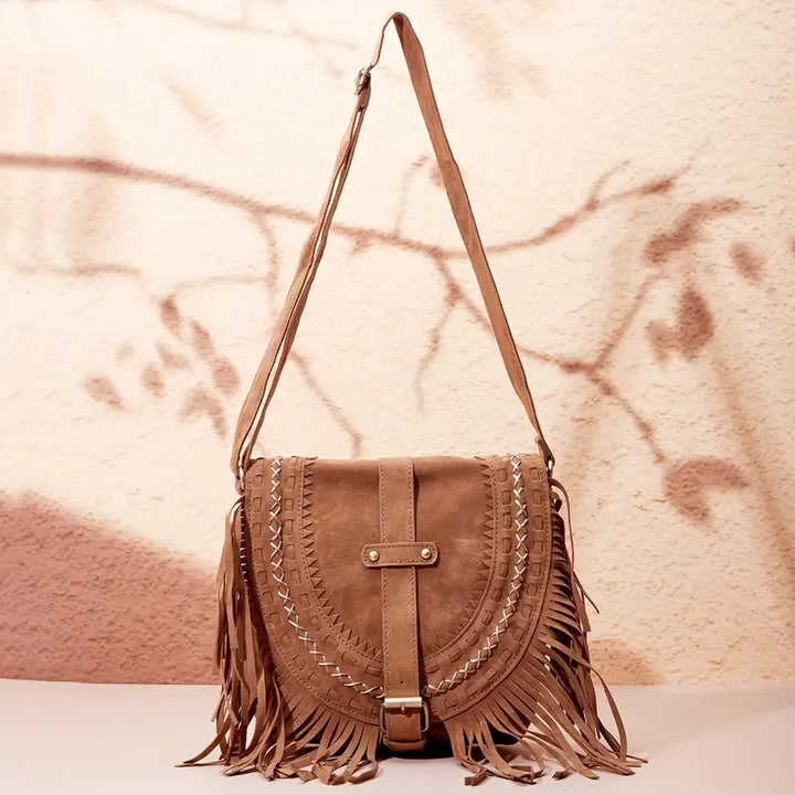 Accessorio donna: borsa a tracolla elegante con nappina, comoda e versatile per stile quotidiano e serate.