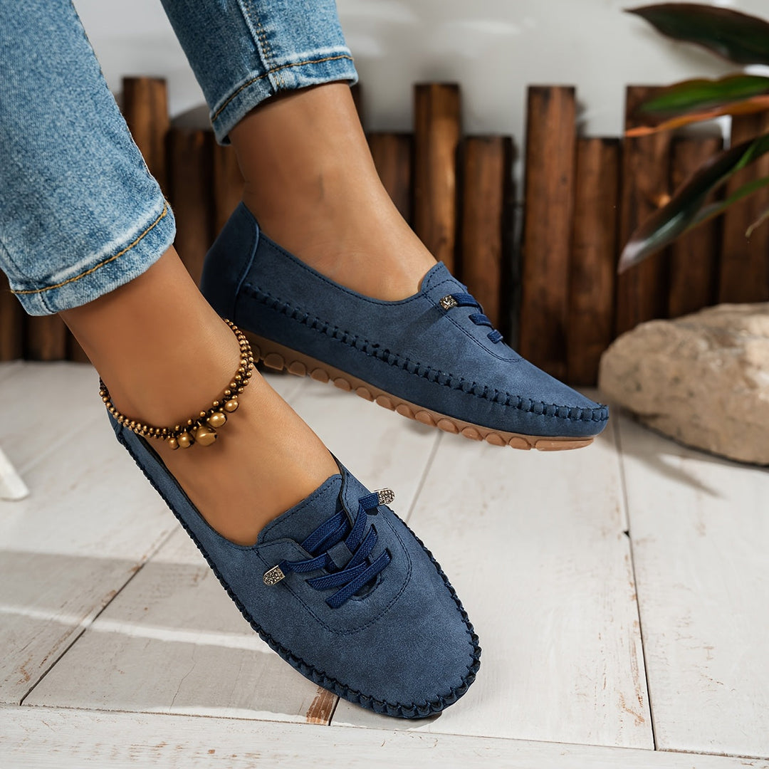 Mocassini donna classici neri, design casual slip-on con supporto e comfort per lunghe passeggiate.