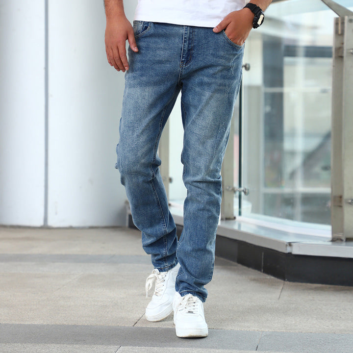 Pantaloni jeans slim fit da uomo con zip, elasticizzati per comfort e stile alla moda.