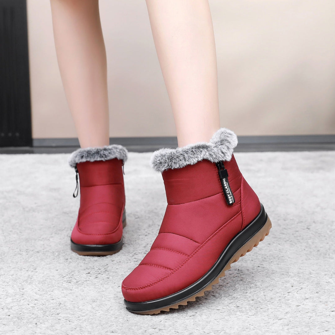 Eleganti stivaletti donna invernali con zip. Scarpe calde e protettive per neve, perfette per la moda e il comfort.