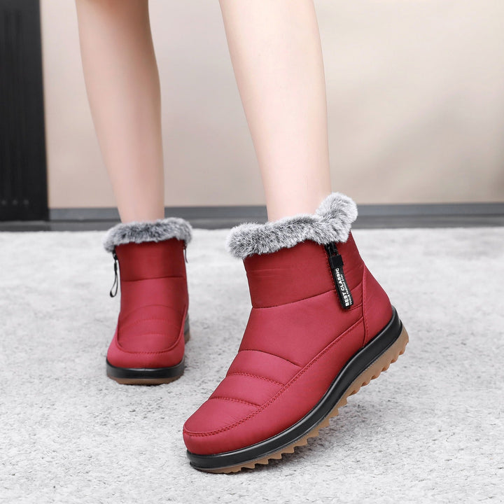 Eleganti stivaletti donna invernali con zip. Scarpe calde e protettive per neve, perfette per la moda e il comfort.