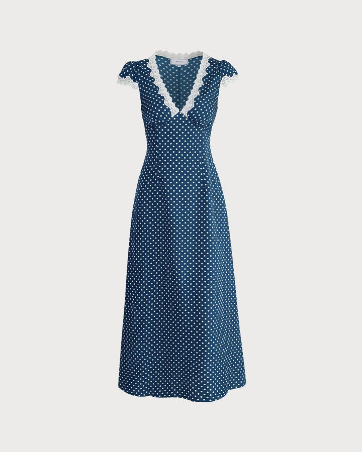 Moda donna: vestito lungo blu navy con pois bianchi, scollo a V profondo, abito da sera per un look chic.