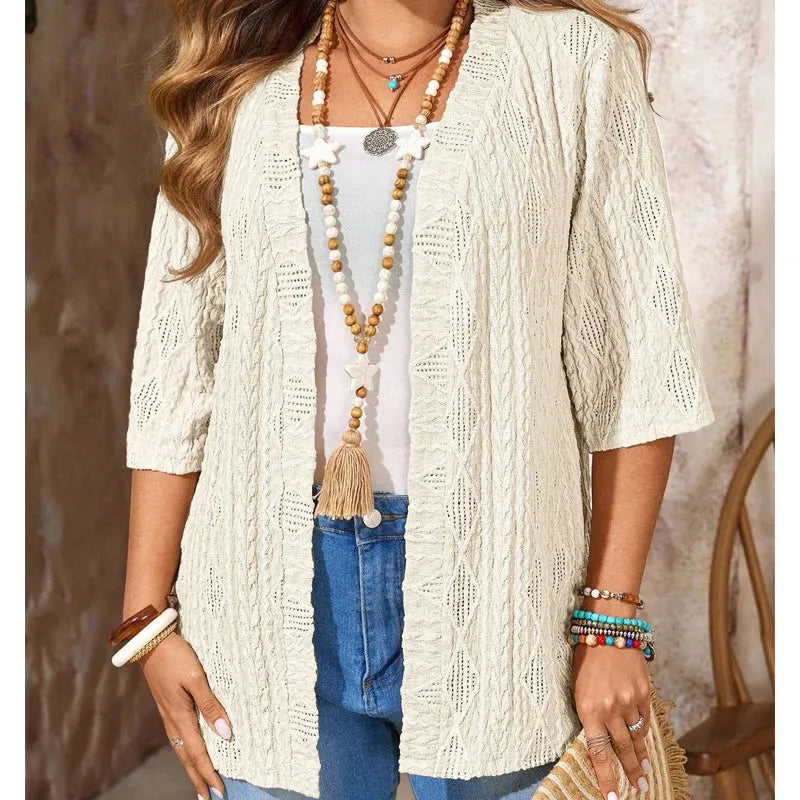 Cardigan donna traforato leggero, maniche 3/4. Un capo essenziale casual chic.