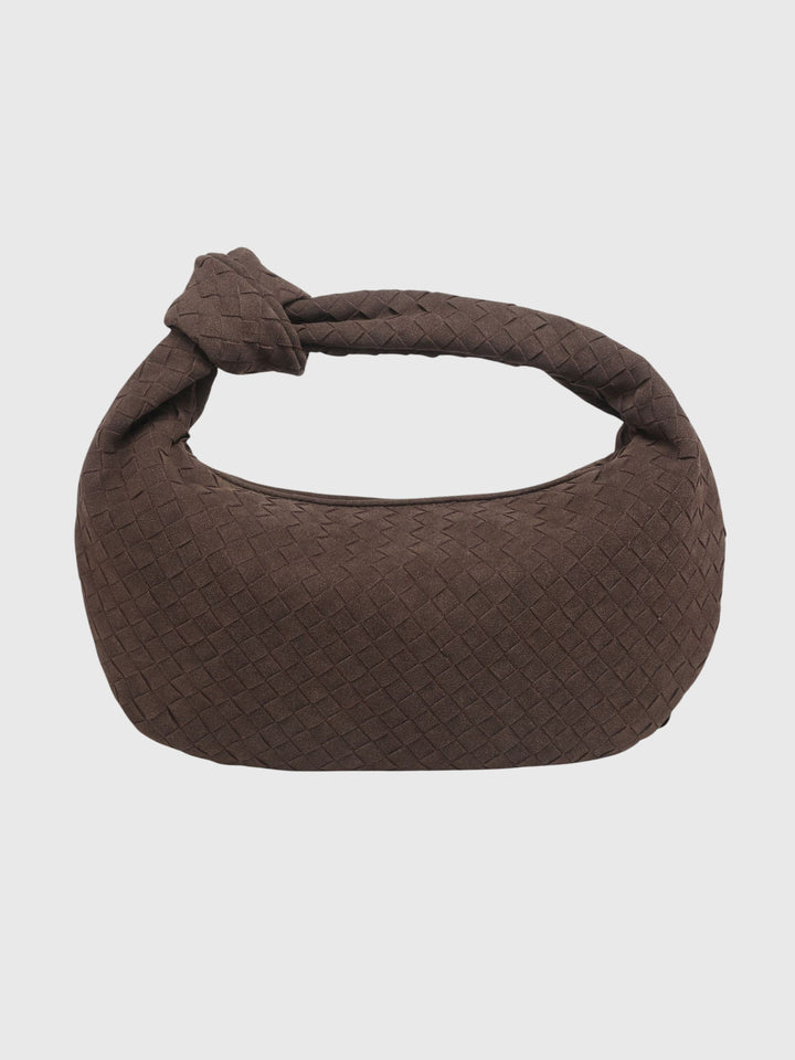 Chic borsa media in suede con lavorazione intrecciata e manico annodato, per un look quotidiano.