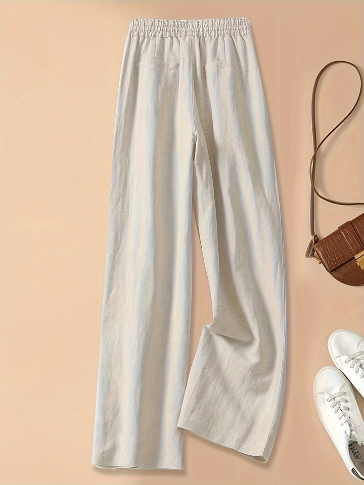 Pantaloni estivi donna beige, a vita alta e relaxed fit con coulisse, ideali per comfort quotidiano.