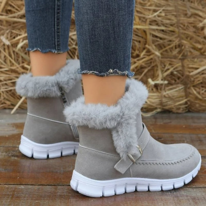 Stivaletti invernali donna con suola antiscivolo, caldi, comodi e alla moda. Dettagli zip e fibbia.