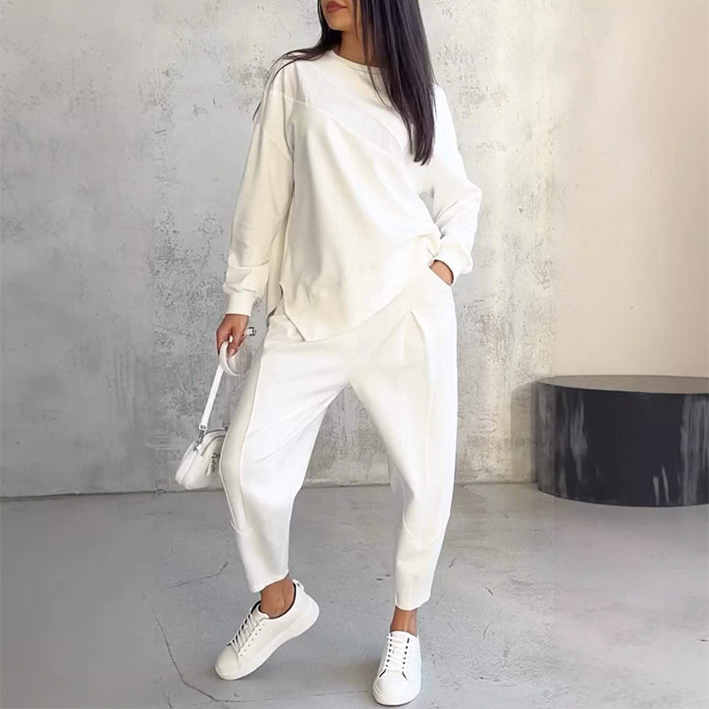 Completo donna casual con felpa asimmetrica e pantaloni comodi in cotone. Perfetto per relax e streetwear.