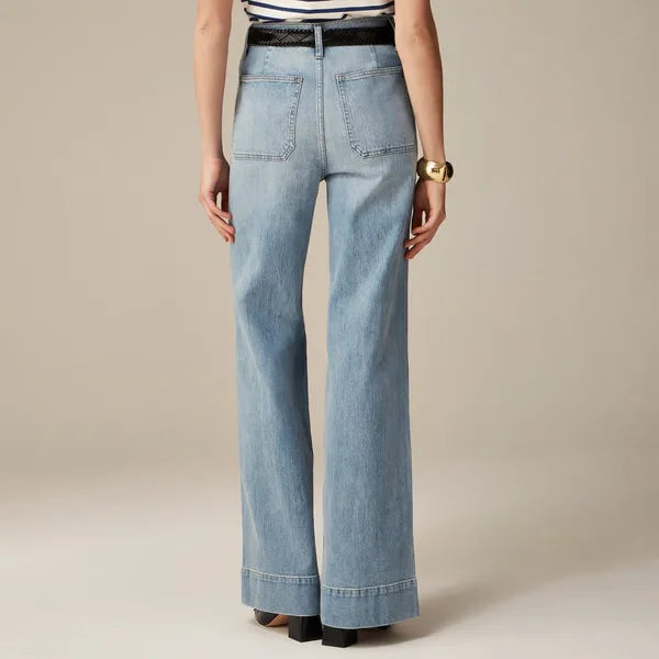 Jeans donna vita alta, gamba larga. Vista posteriore, enfatizza vestibilità e stile.