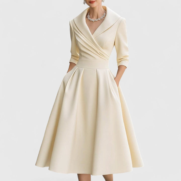 Abito midi donna con scollo a V e tasche, maniche 3/4, versatile ed elegante per il giorno e la sera.