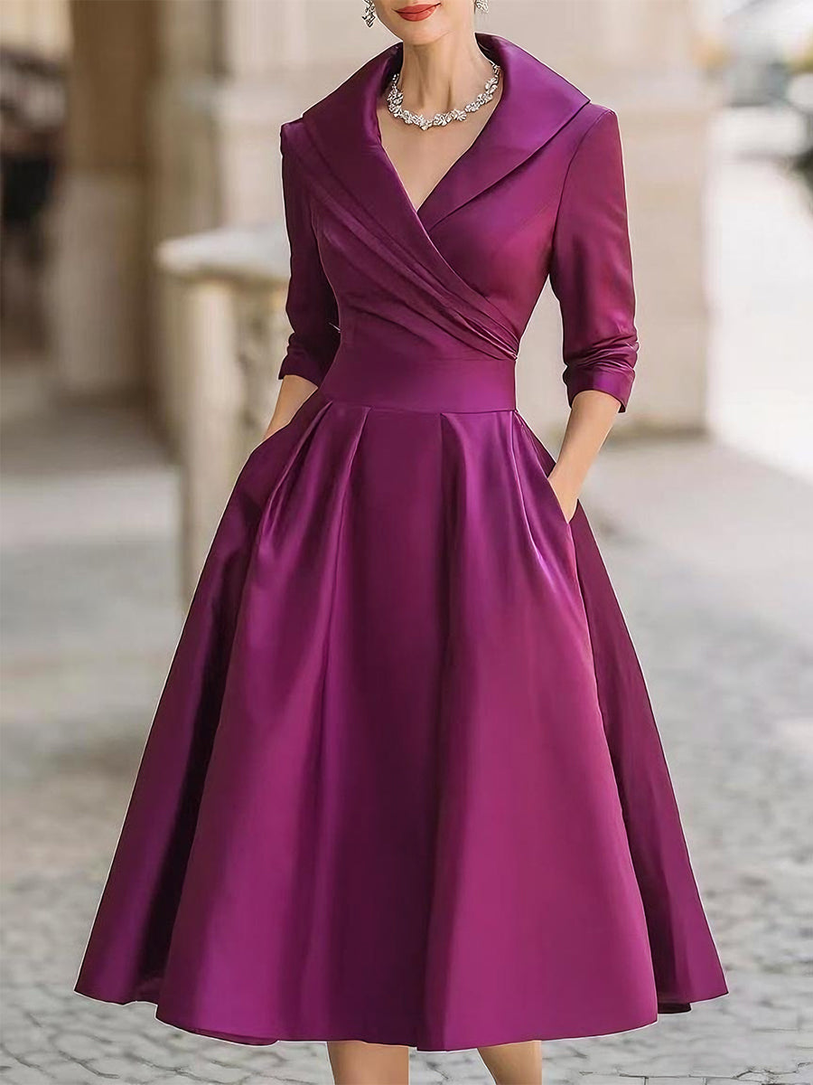 Versatile abito midi da sera, con plissettature e linea A-line, per un look vintage raffinato.
