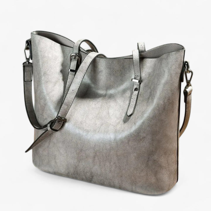 Borsa tote marrone versatile per donna con tracolla regolabile e removibile, accessorio moda essenziale.