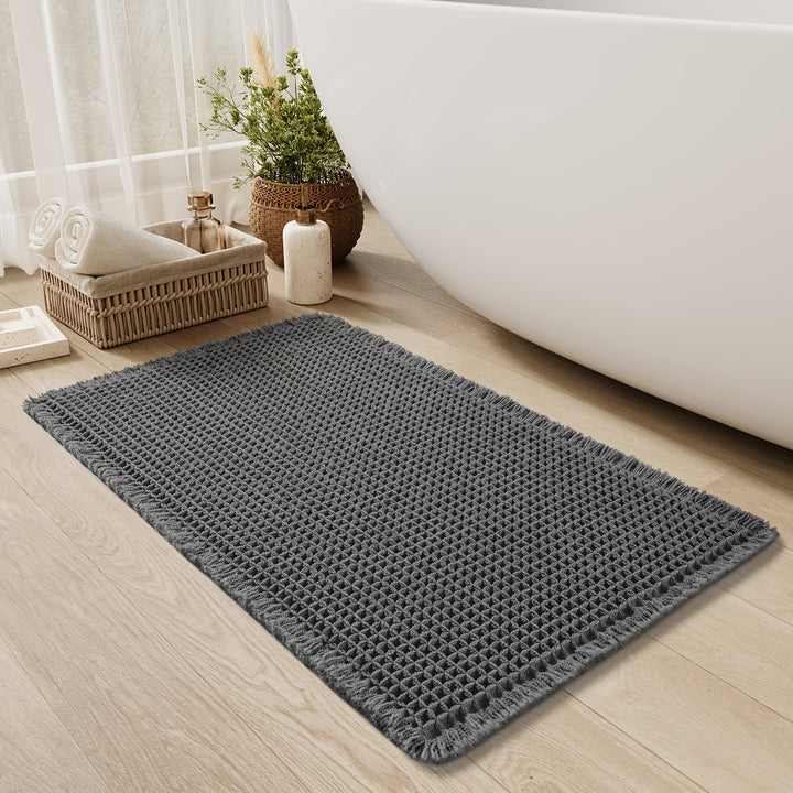 Tappeto per doccia ultra assorbente, lavabile e antiscivolo. Il motivo a nido d'ape aggiunge stile al bagno.