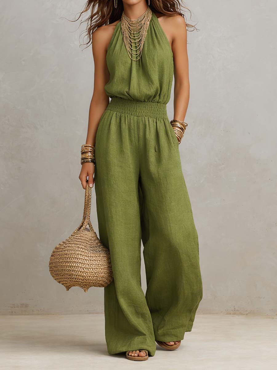 Elegante tuta estiva donna con scollo halter, vita definita e pantaloni ampi. Ideale per un look sofisticato.