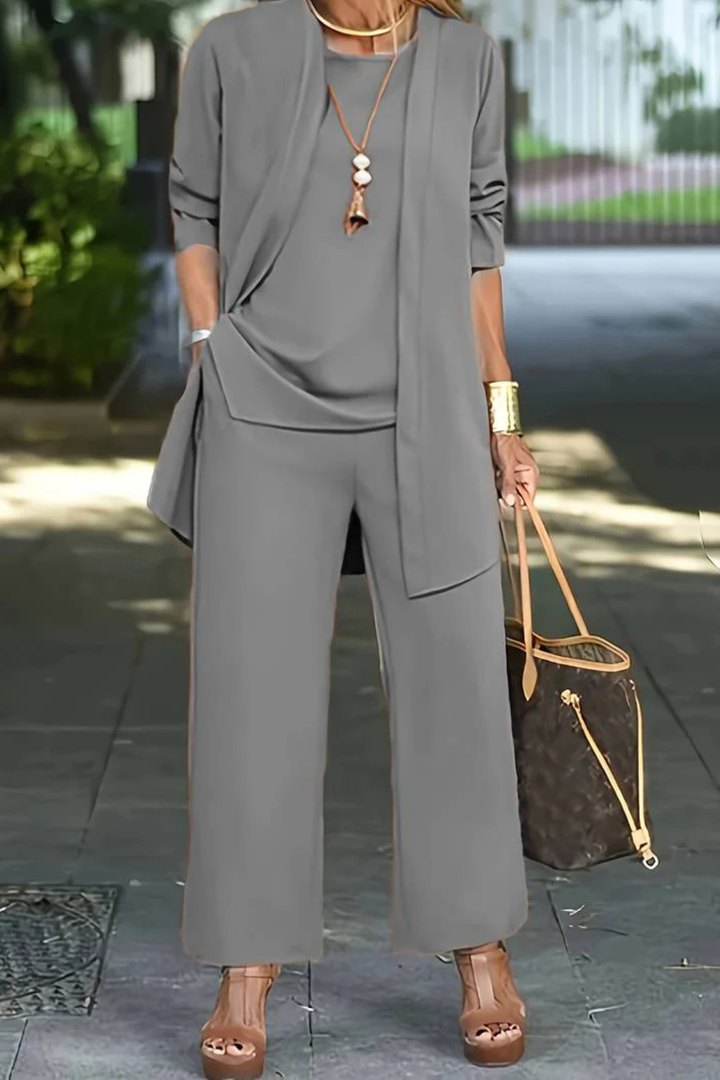 Completo elegante donna, look raffinato con pantaloni larghi. Set tre pezzi versatile per moda donna e ufficio.