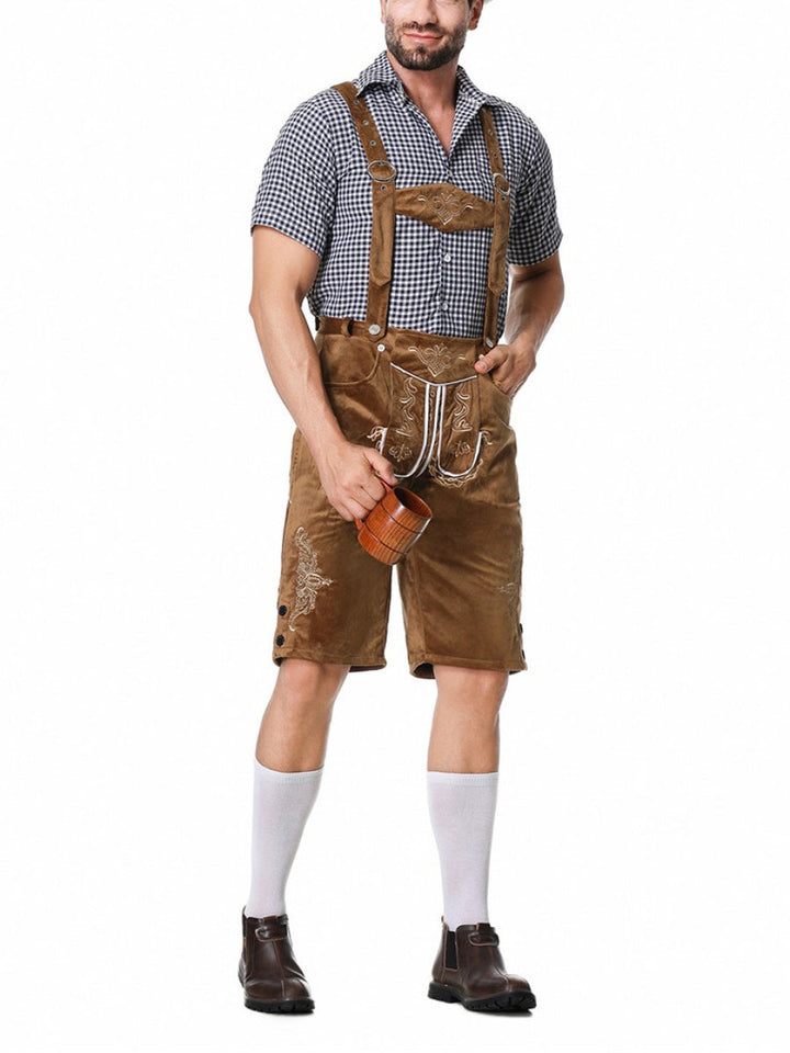 Camicia a quadri e bretelle su Lederhosen, componenti essenziali del completo tradizionale bavarese Oktoberfest uomo.