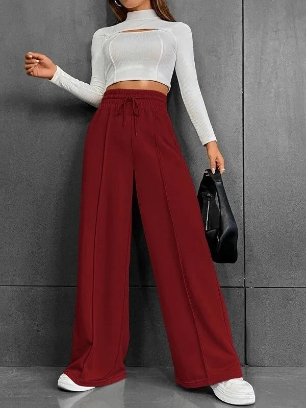 Donna: pantaloni a vita alta con gamba ampia, tessuto leggero per massimo comfort quotidiano.