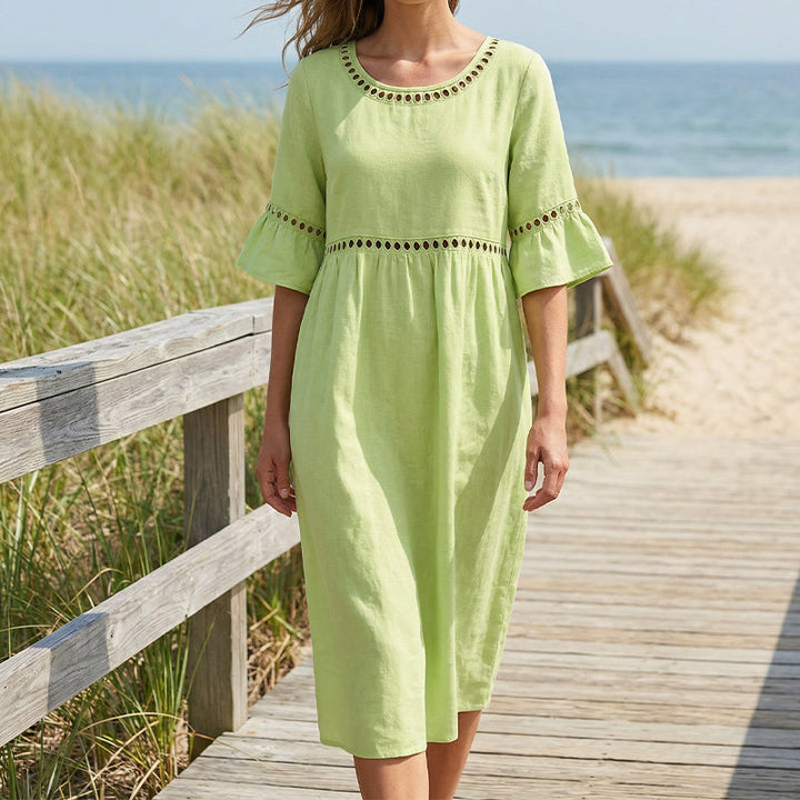 Elegante abito midi contenitivo da donna, valorizza la silhouette e offre un look sofisticato e chic.