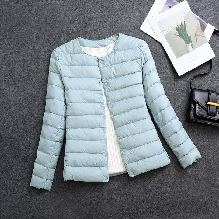 Giacca imbottita donna, scollo rotondo, per calore e comfort in stile casual elegante.