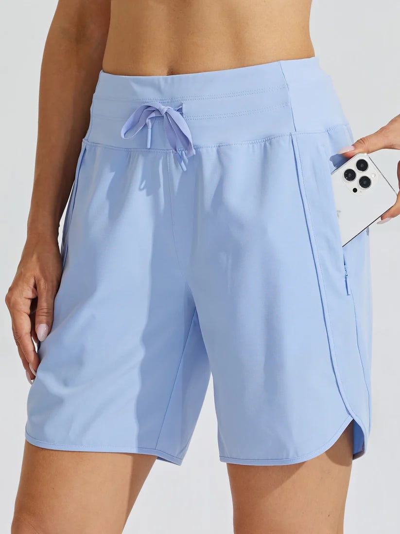 Shorts sportivi donna vita alta neri con cordino e tasche, ideali per fitness e look casual estivi.
