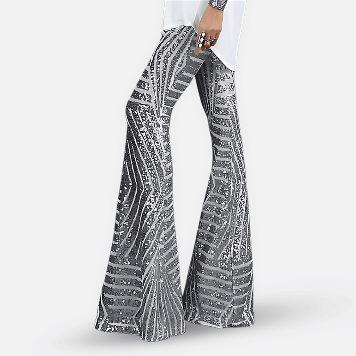 Eleganti pantaloni donna a zampa con paillettes brillanti e vita alta, ideali per un look serale glamour.