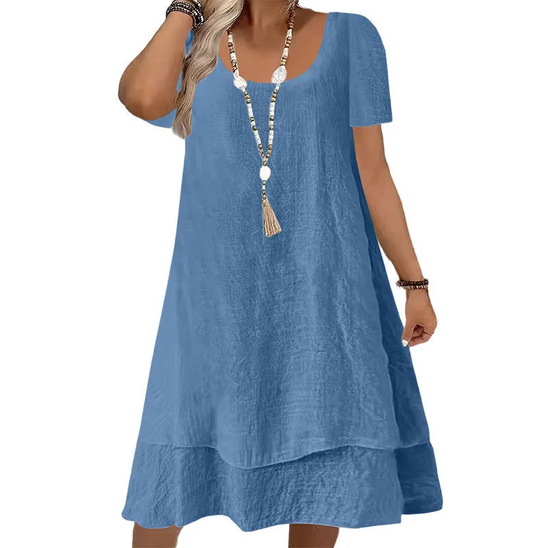 Vestito casual donna in tessuto leggero, ideale per la primavera estate, con vestibilità ampia e maniche corte.