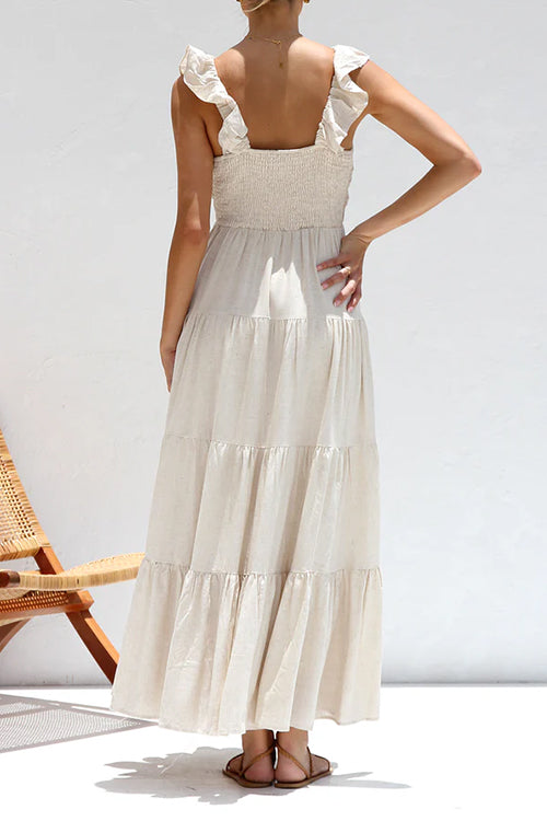 Abito lungo estivo da donna con scollo a V, balze e stile senza maniche. Un maxi abito casual ed elegante.