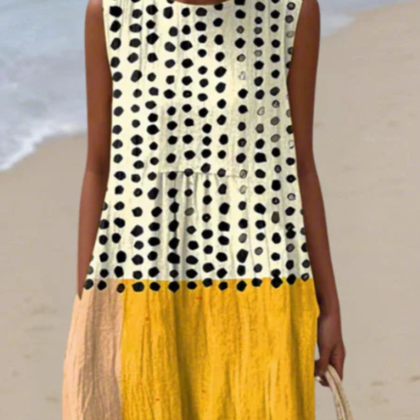 Vestito estivo lungo donna a pois, vestibilità comoda. Ideale per look casual, viaggi o eleganza quotidiana.